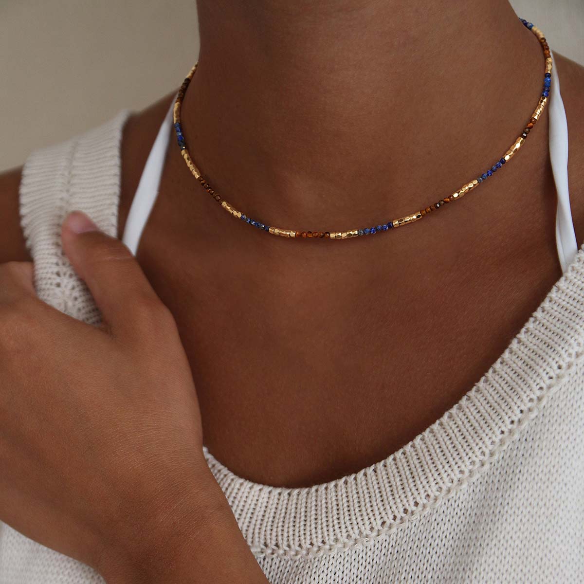 Woman wearing the Myears® Lapis Lazuli Beaded Choker Necklace, natural lifestyle look, blue gemstone beaded choker for everyday styling