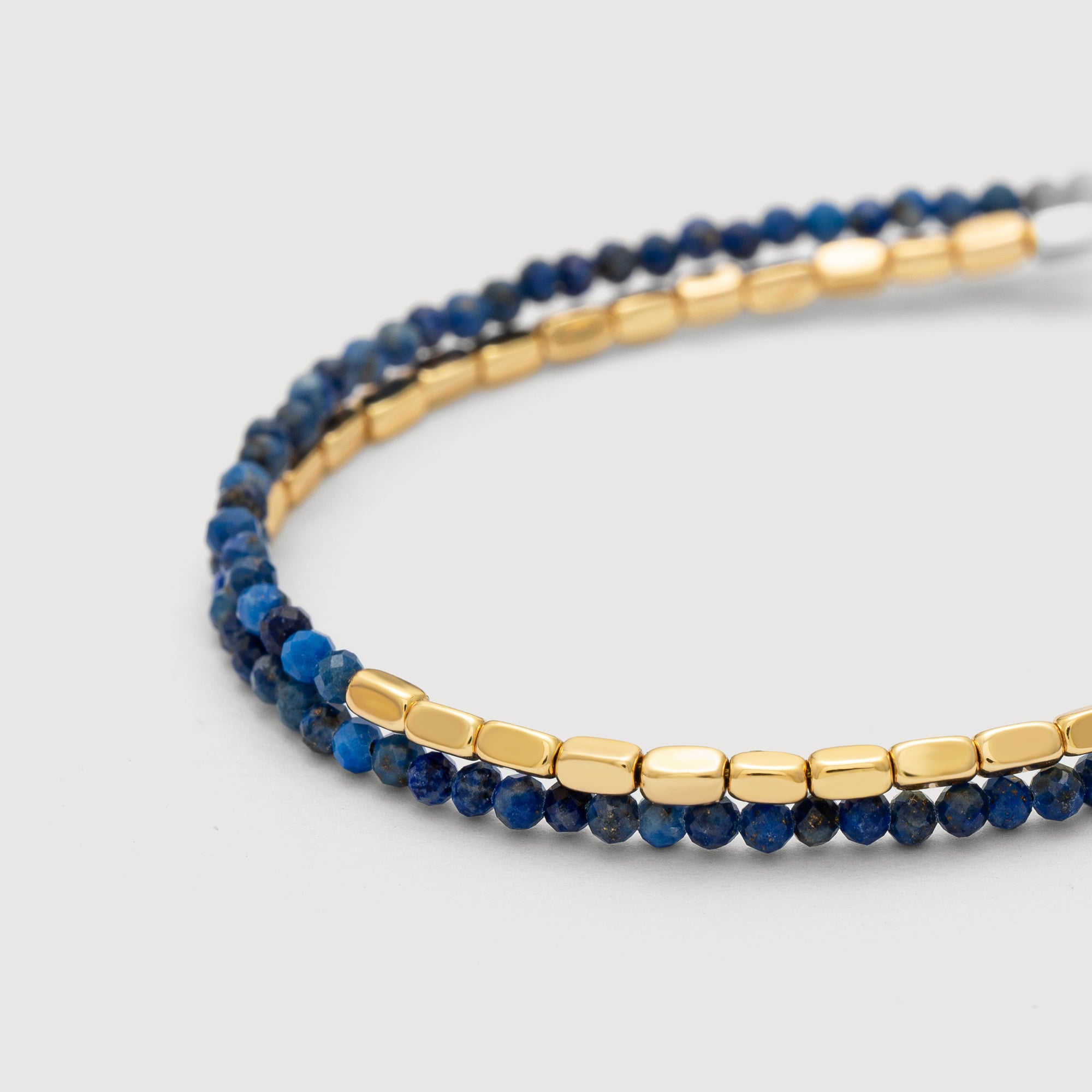 Detail shot of the Myears® Lapis Lazuli Square Chain Double-Layer Bracelet showing the 14k gold-plated chain and polished Lapis Lazuli beads