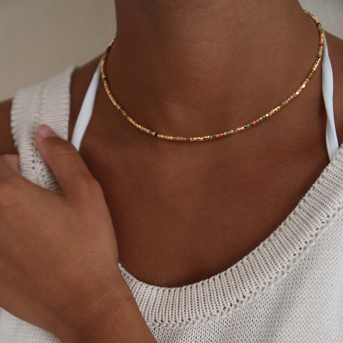 Model wearing the Myears® Malachite and Garnet Beaded Choker Necklace, natural lifestyle look, green and red gemstone beaded choker for women.