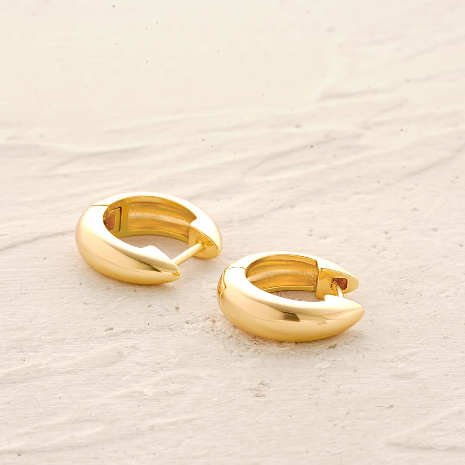 Detail of Small Huggie Hoop Earrings showing gold finish and delicate design