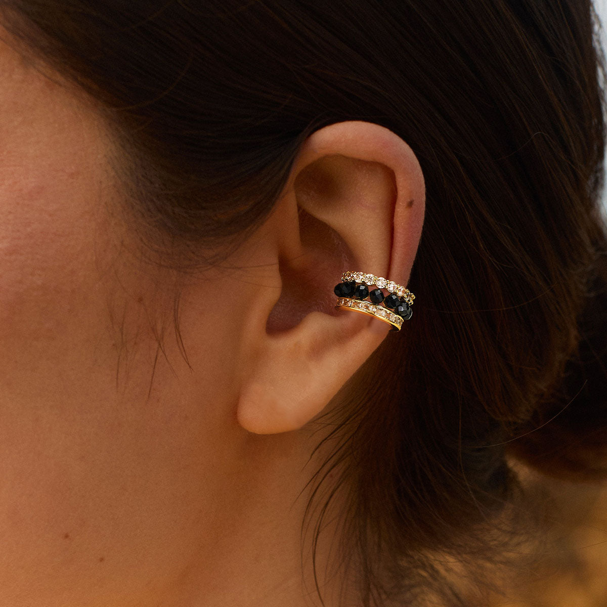 Lifestyle image of MYEARS® black onyx ear cuff on a woman, minimalist gold ear cuff styled for everyday wear and gift ideas