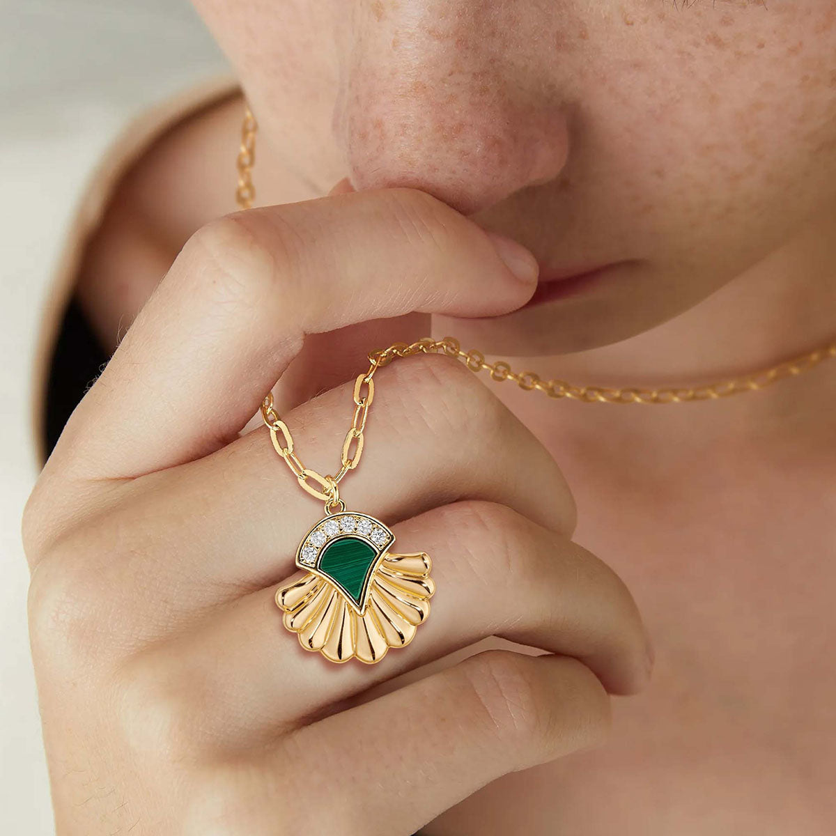 Model wearing MYEARS Bohemian Malachite Pendant Necklace in gold, elegant bohemian malachite necklace for women