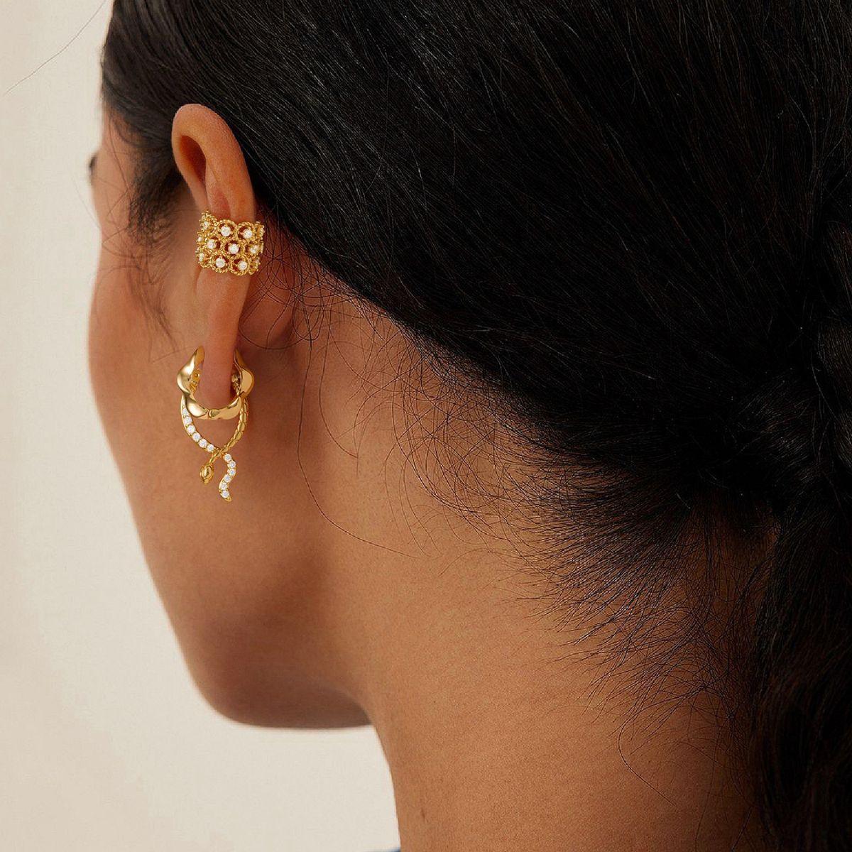 Close-up of a model wearing MYEARS® Bubbles Pave Ear Cuffs, showcasing the sparkling pave bubbles and polished gold finish for a chic look