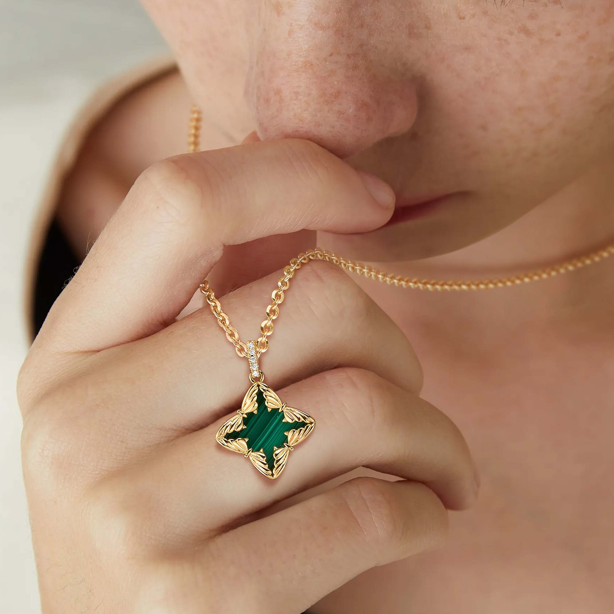 Model wearing MYEARS Butterfly Malachite Pendant Necklace in gold, stylish butterfly malachite necklace for women
