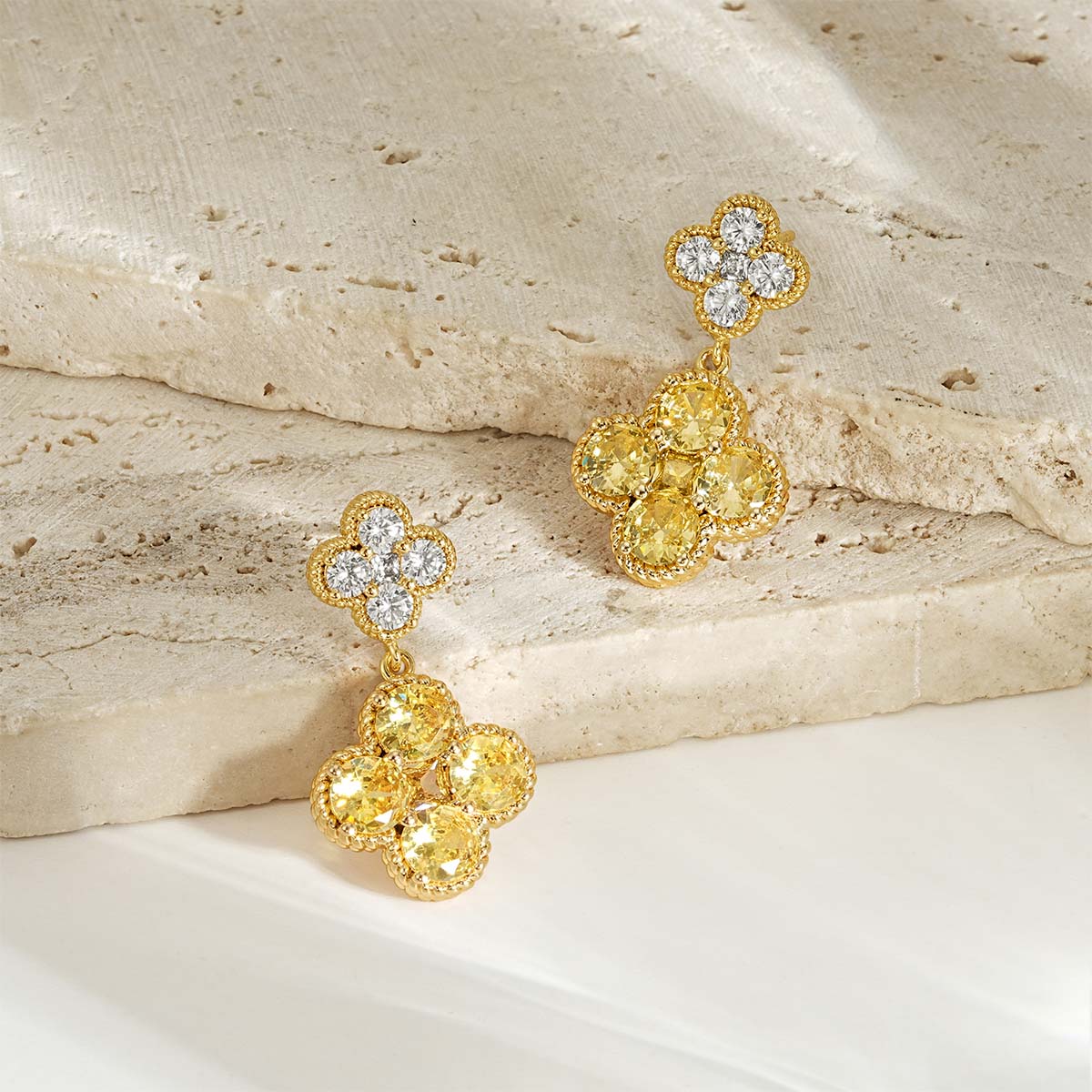 Close-up detail of MYEARS gold Clover Flower November birthstone dangle stud earrings craftsmanship