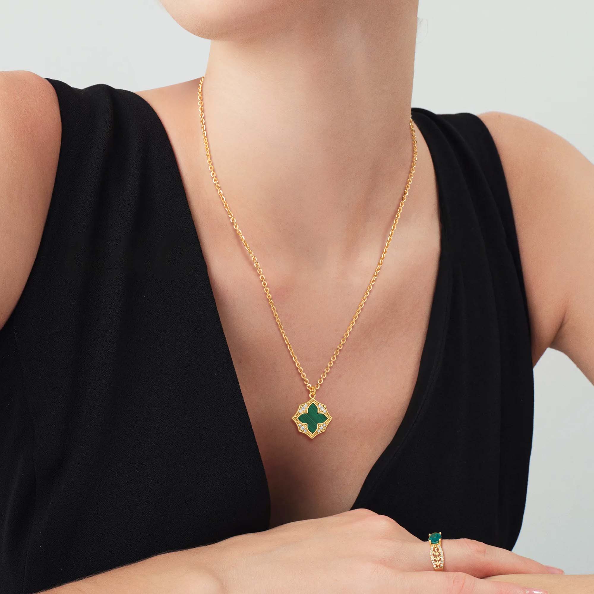 Model wearing MYEARS Cross Malachite Pendant Necklace in gold, stylish cross-shaped malachite necklace for women