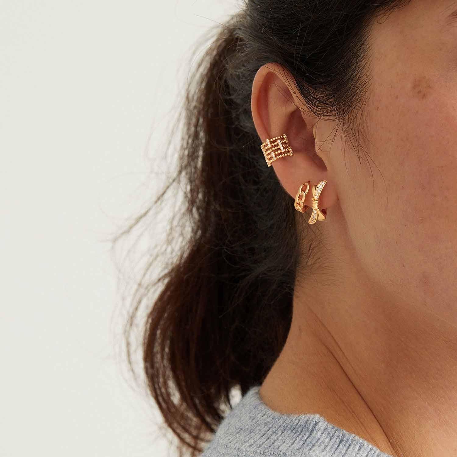 Model wearing MYEARS® Cuban Chain Link Hoop Earrings, 14K gold, Cuban chain hoop design, elegant and versatile earrings for women, ideal gift for her, suitable for everyday wear.