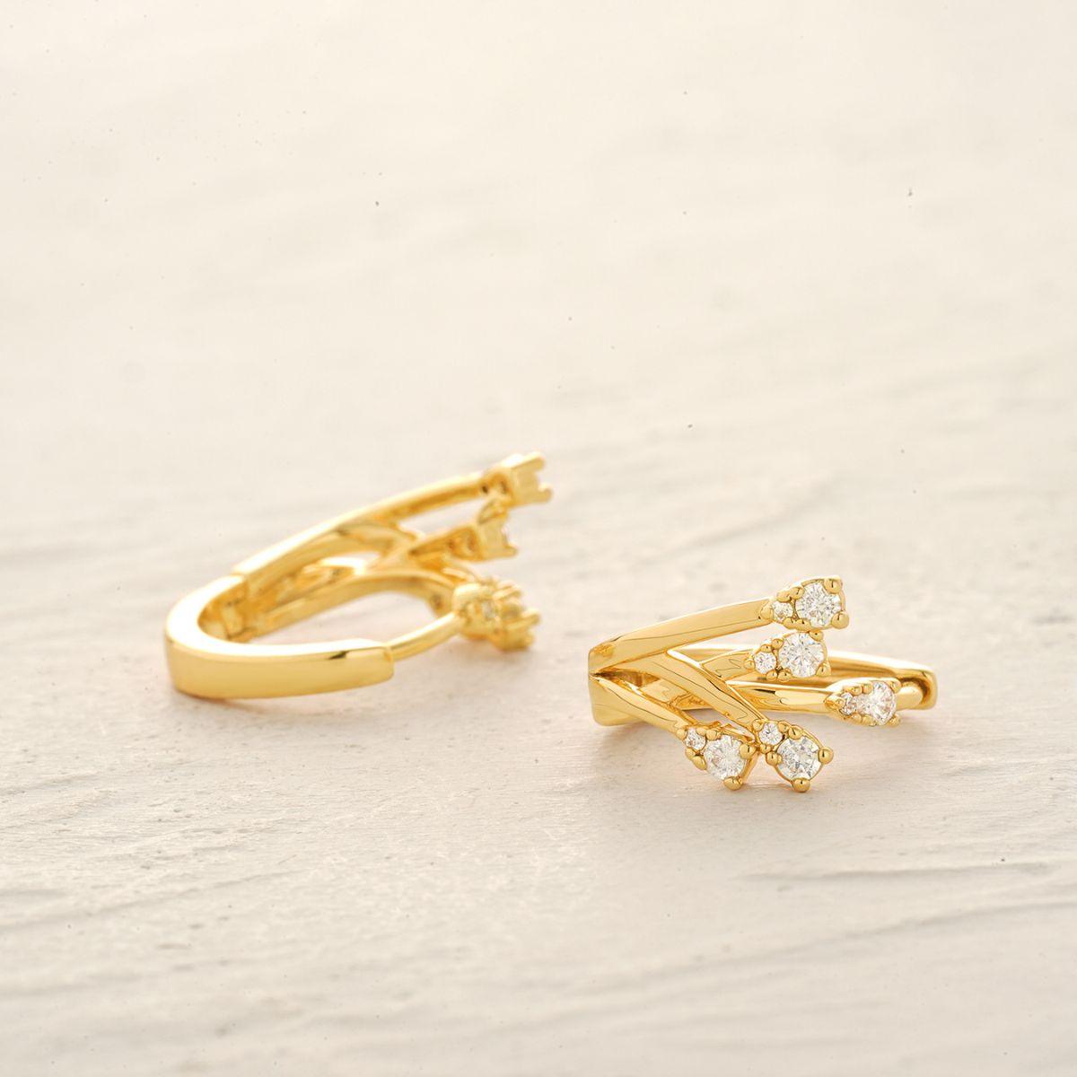 Detailed view of MYEARS® Cubic Zirconia Crossover Hoop Earrings showing the intricate gold hoop design and sparkling cubic zirconia stones