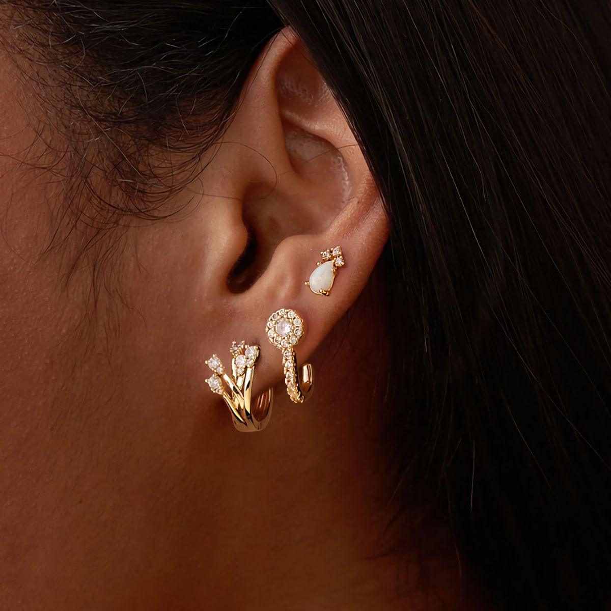 Lifestyle view of MYEARS® Cubic Zirconia Crossover Hoop Earrings in gold, perfect as a gift or to elevate everyday outfits with a touch of sparkle