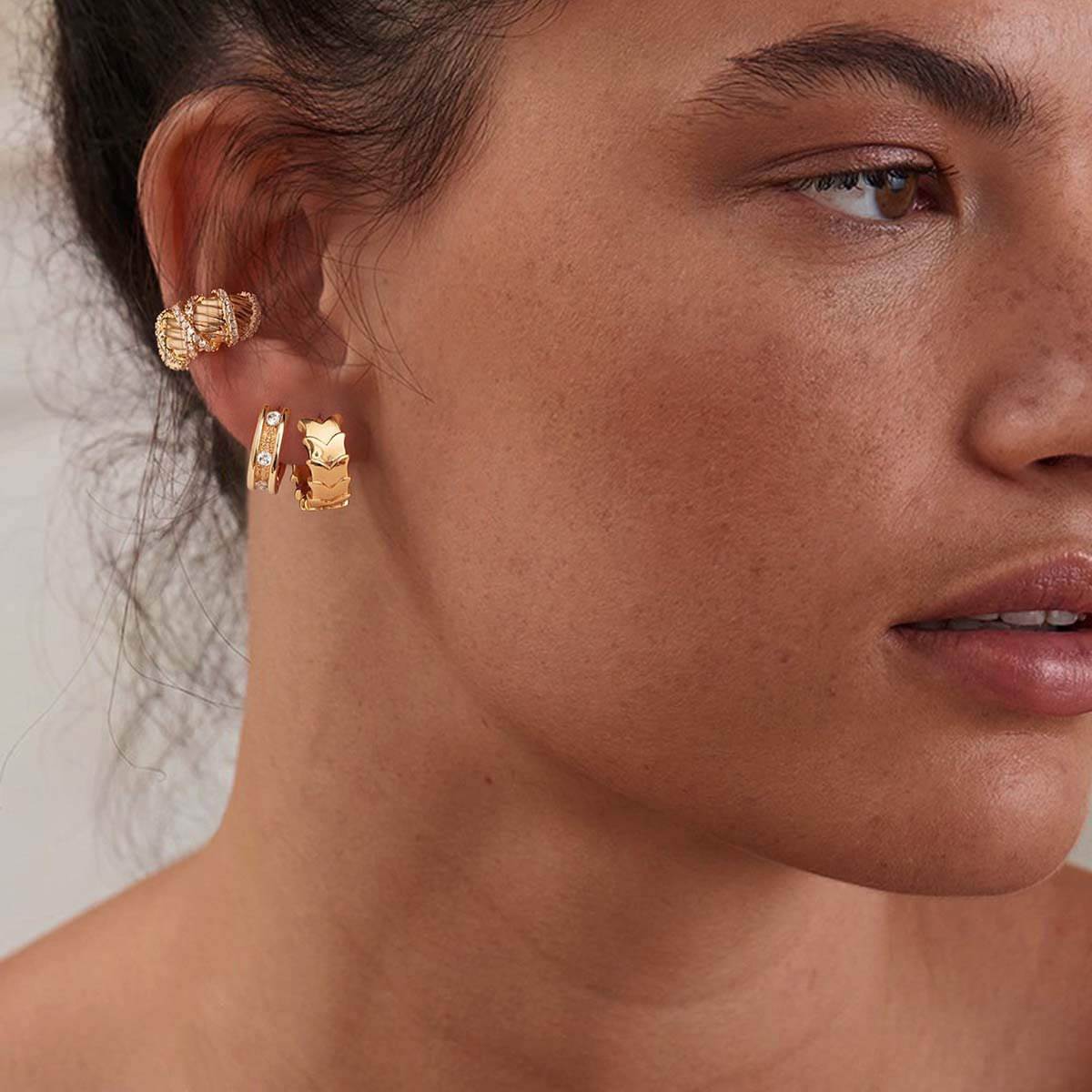 Woman wearing MYEARS® CZ Channel Hoop Earrings in gold, showing the clean channel-set cubic zirconia hoops styled for daily wear