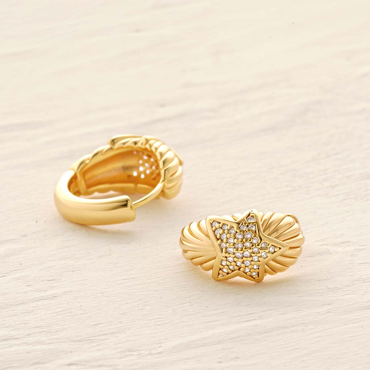Detailed scene of MYEARS® CZ Star Hoop Earrings in gold, focusing on the star-shaped cubic zirconia