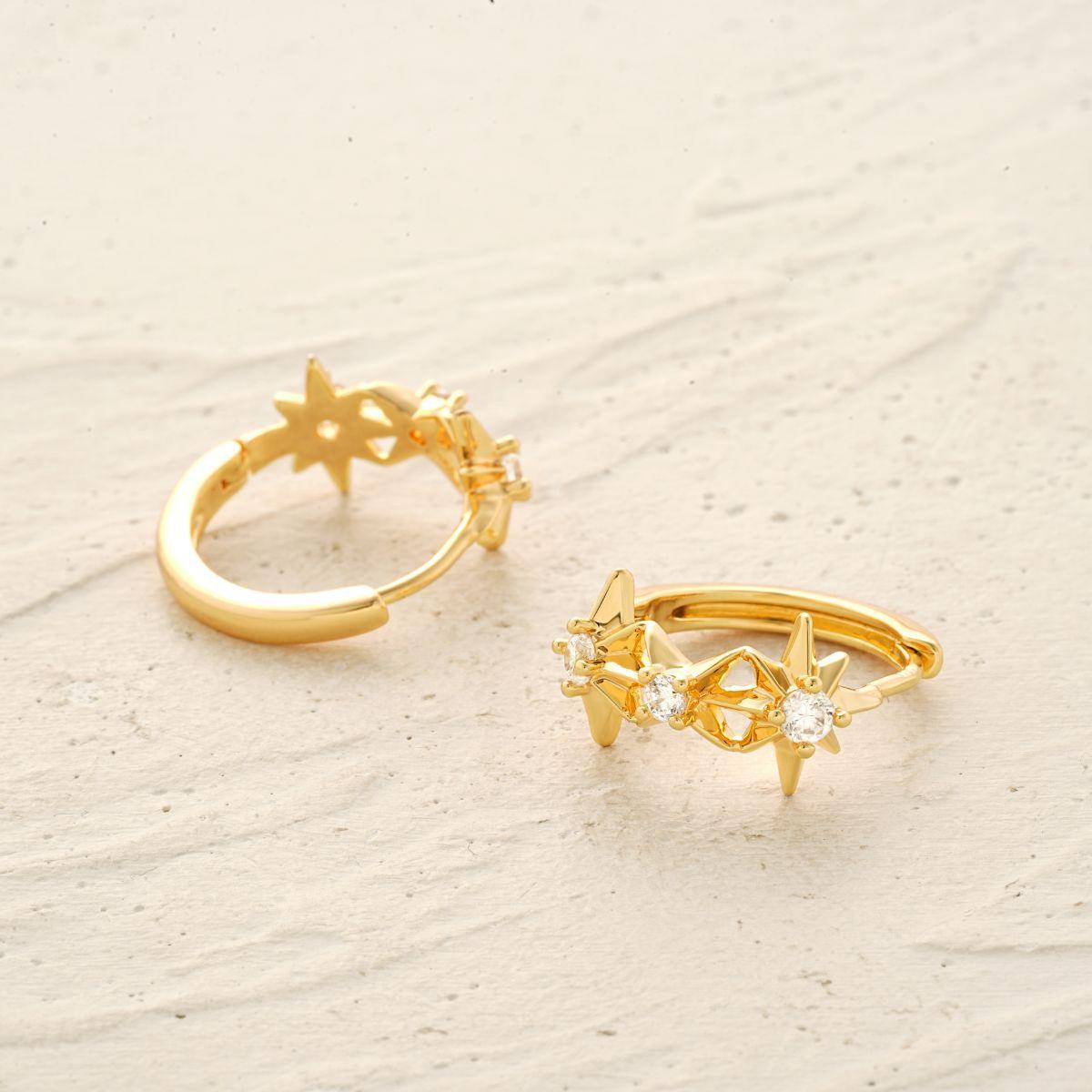 MYEARS® CZ Star Huggie Hoop Earrings worn by a woman, showing sparkling cubic zirconia stars and elegant gold huggie design