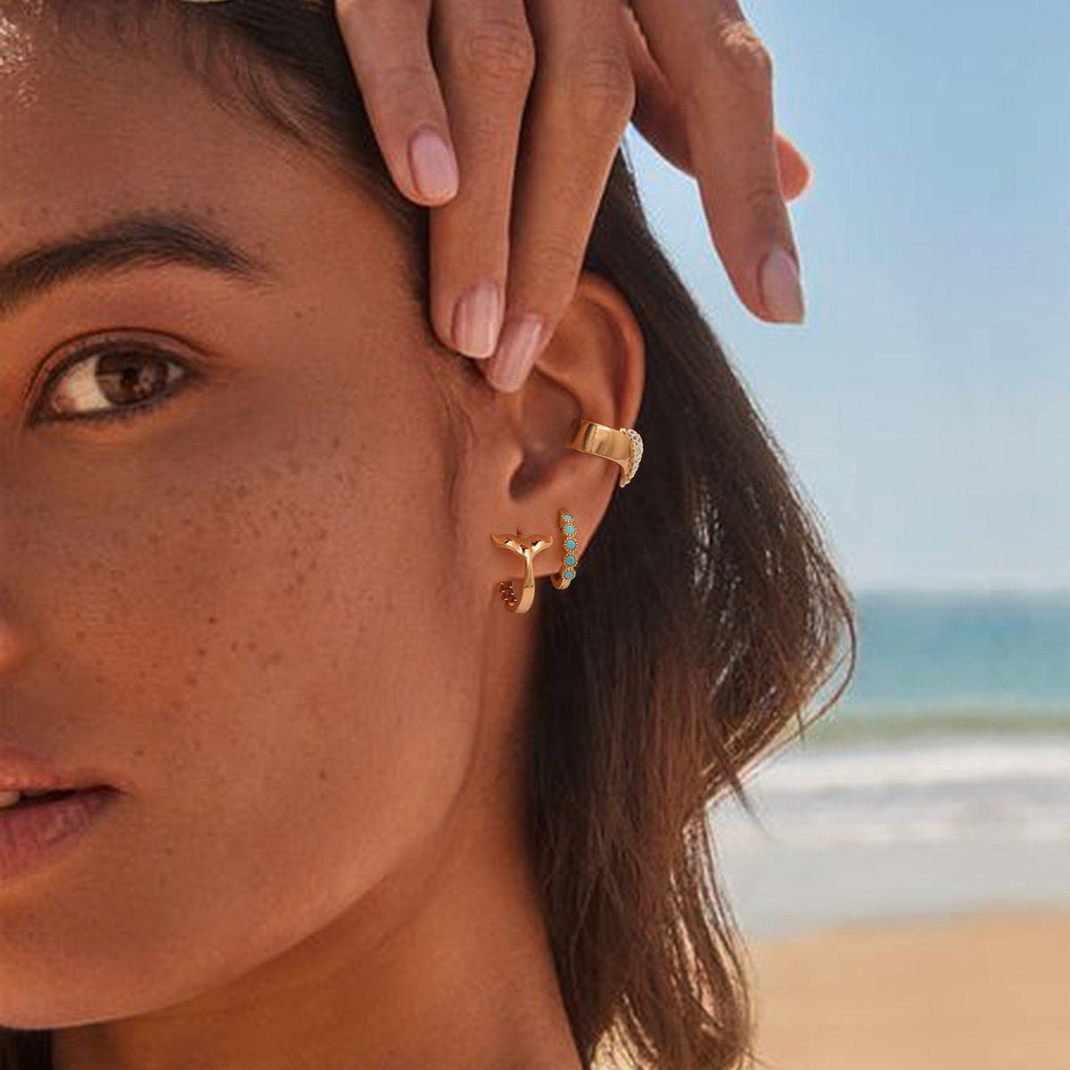 Model styling MYEARS® dainty spell ear cuffs as an everyday gold accessory, ideal as a modern jewelry gift for women