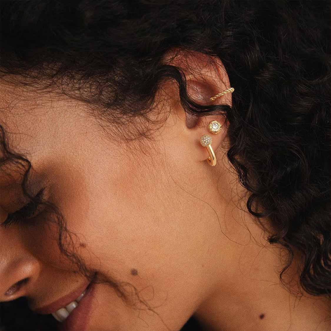 Close-up of model wearing MYEARS® gold Donut Fairy Stud Earrings, whimsical earrings for women, suitable for daily wear and gifting