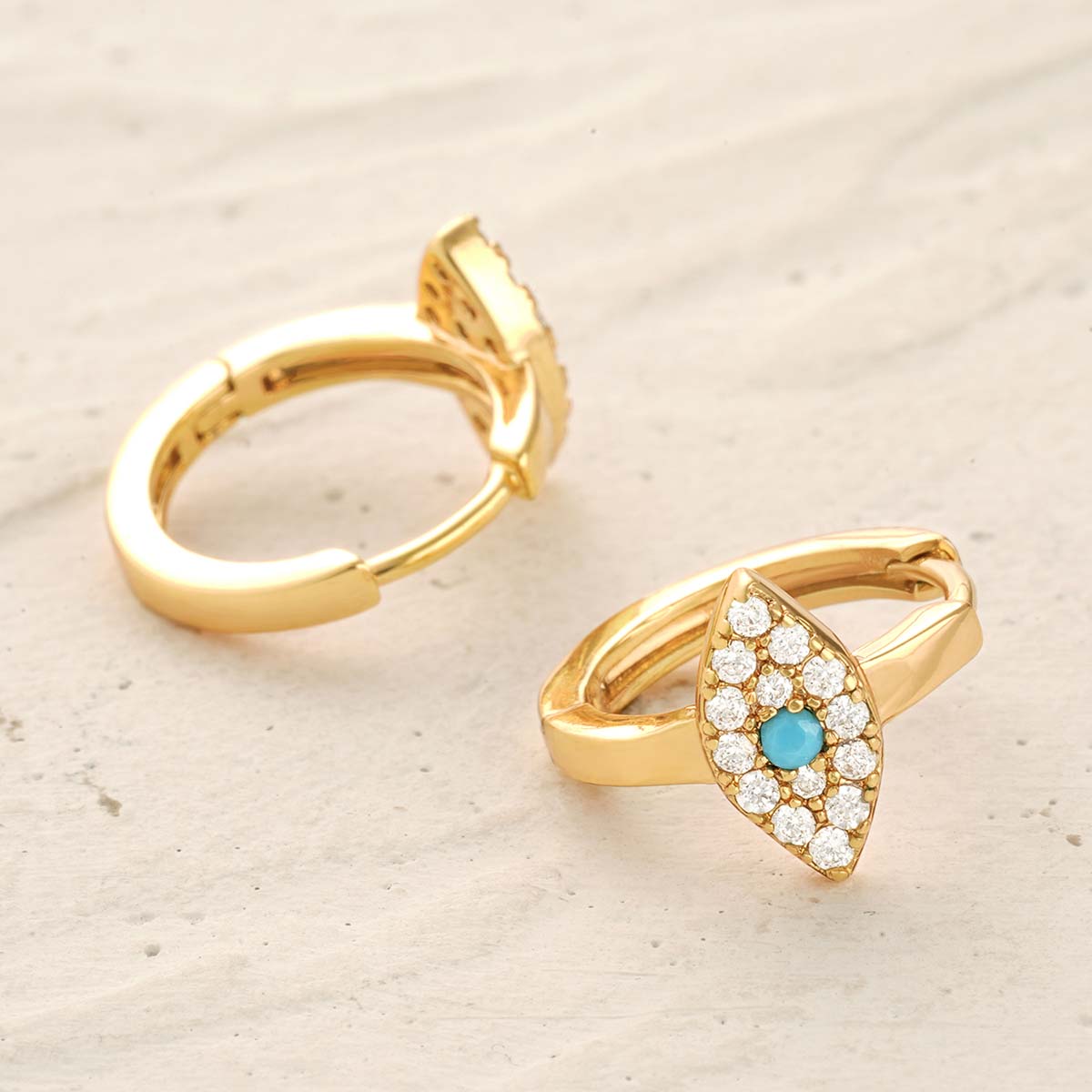 Detailed view of MYEARS® Evil Eye Hoop Earrings in gold, highlighting craftsmanship, smooth finish, and unique evil eye design