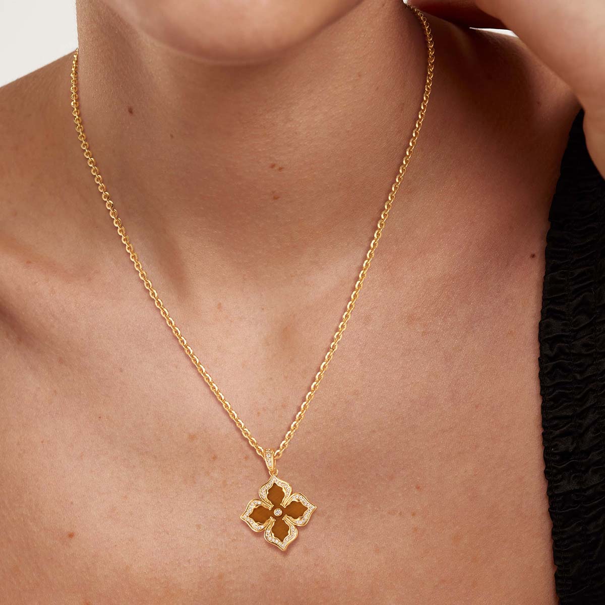 Model wearing MYEARS Four Leaf Clover Flower Pendant Necklace with Yellow Tiger Eye in gold, elegant and lucky design for women, perfect for everyday wear