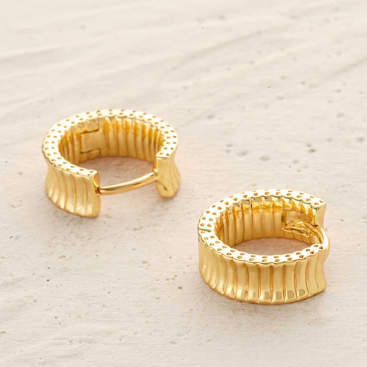 Detailed view of MYEARS® frill trough huggie earrings highlighting the textured frill design and shiny gold finish for women