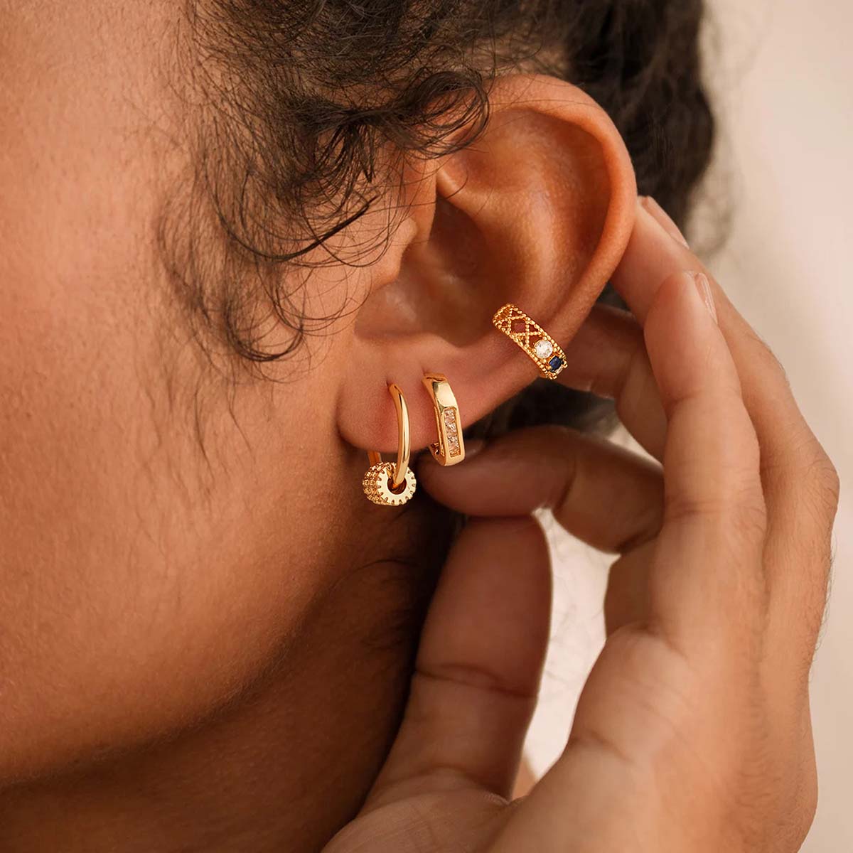 Close-up of MYEARS® Gear Bead Dangle Hoop Earrings in gold on model, showcasing delicate bead design and versatile style