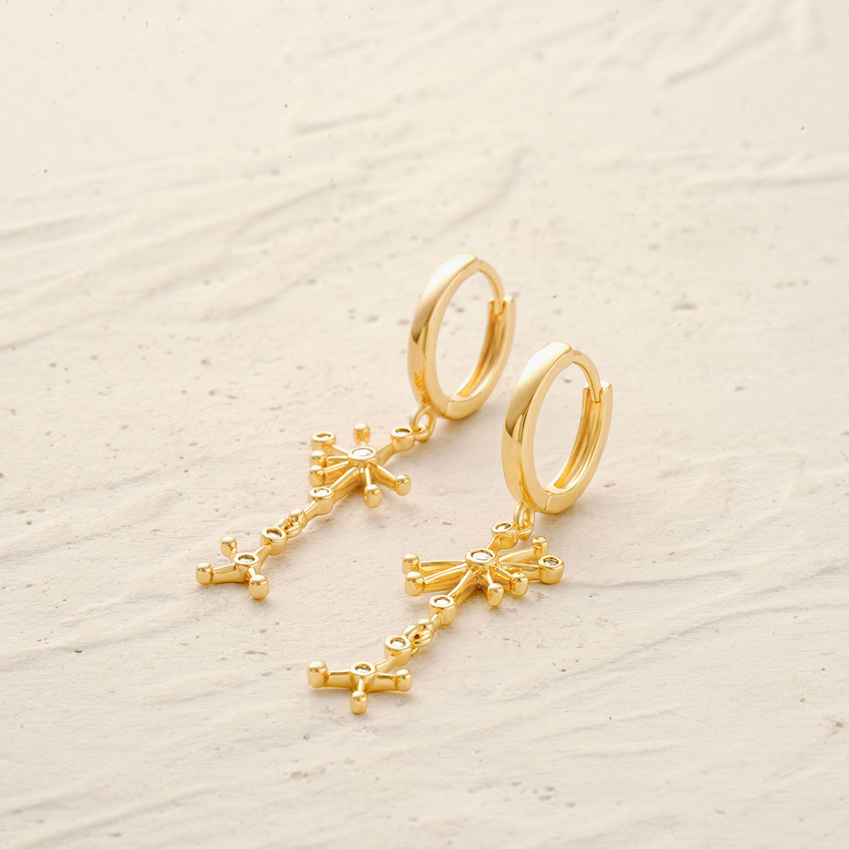 Detailed view of MYEARS® gold star dangle earrings, showcasing fine craftsmanship, a thoughtful gift for women