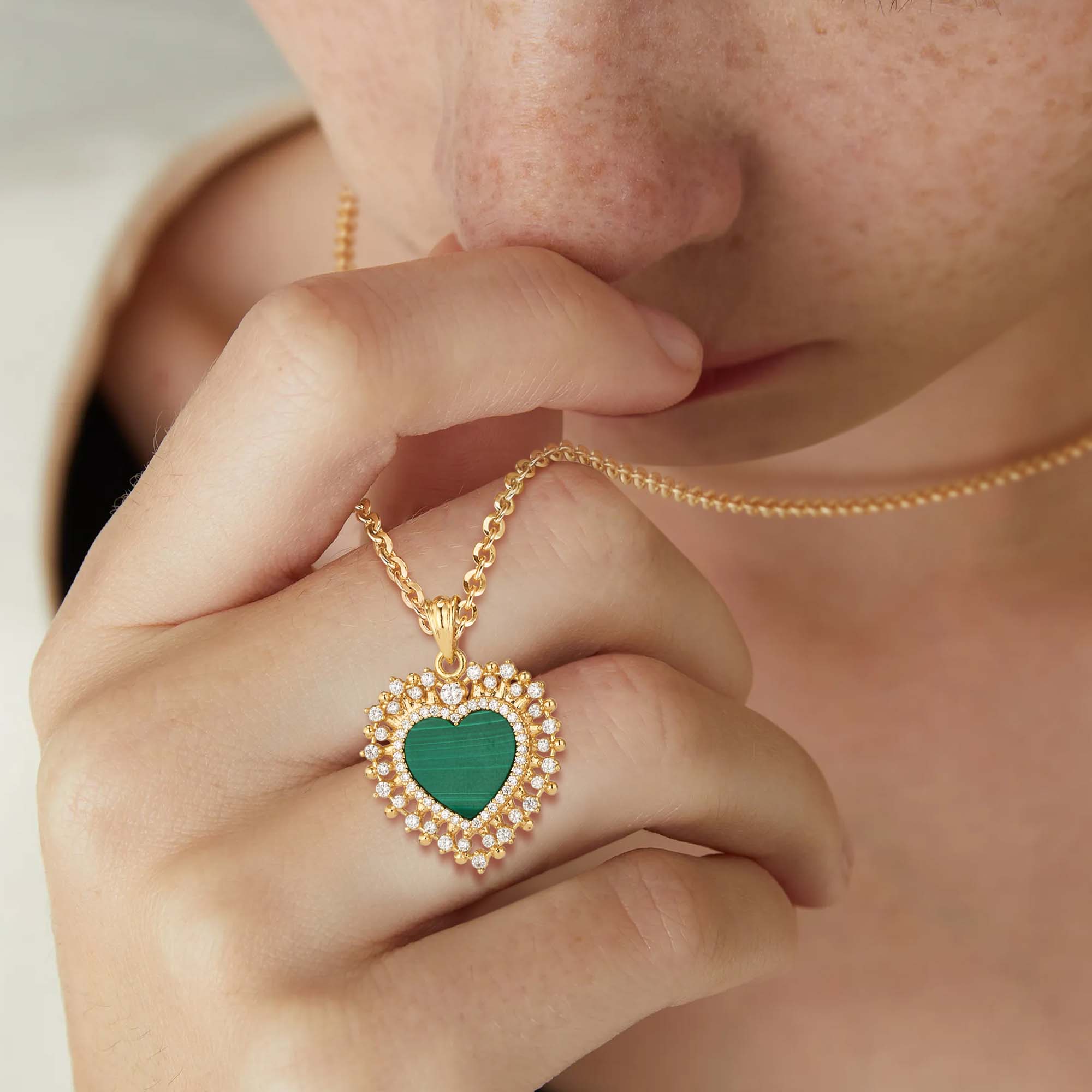 Model wearing MYEARS Heart Malachite Pendant Necklace in gold, elegant malachite heart necklace for women