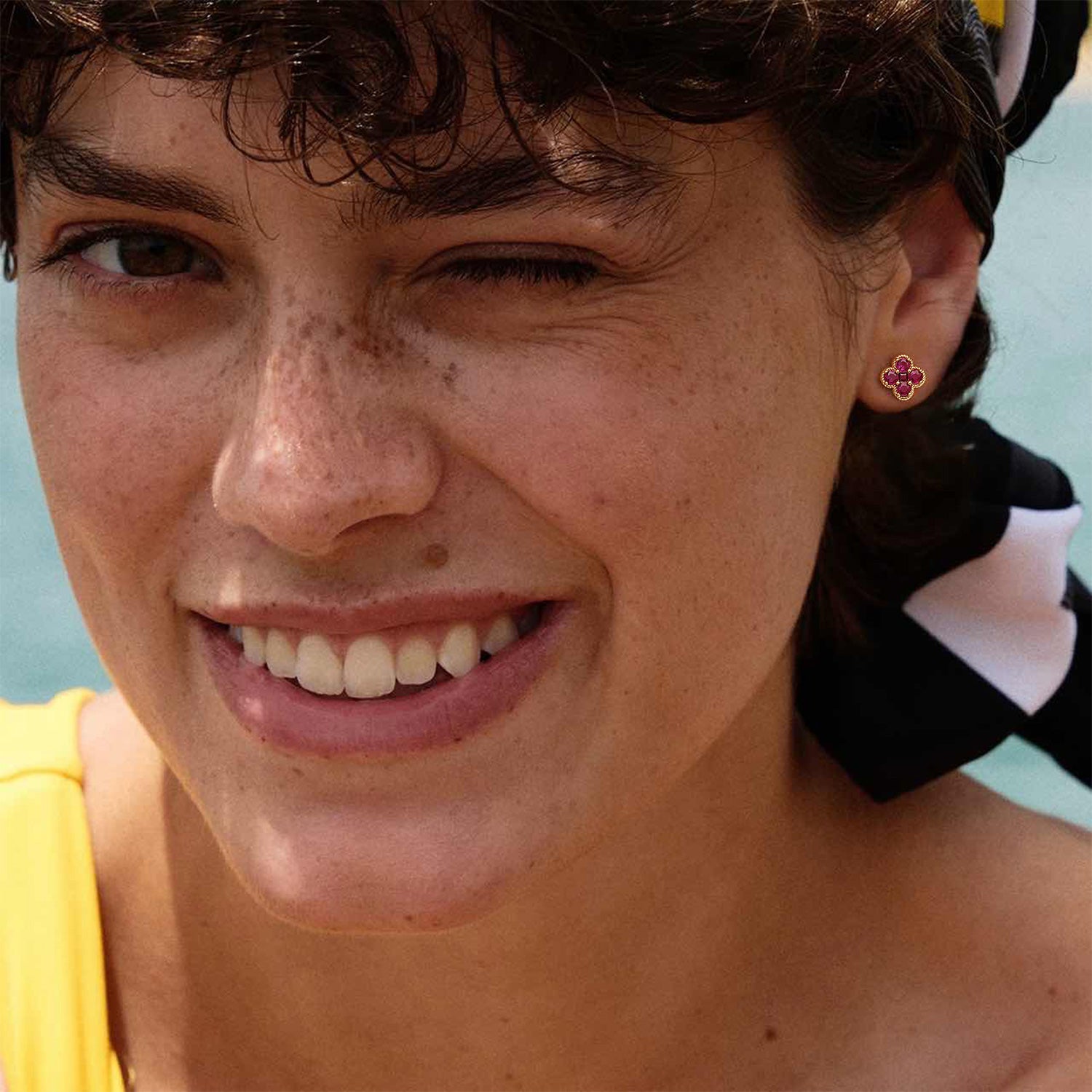 Model wearing MYEARS July Flower Birthstone Stud Earrings in gold, elegant and lucky design for women, perfect for everyday wear