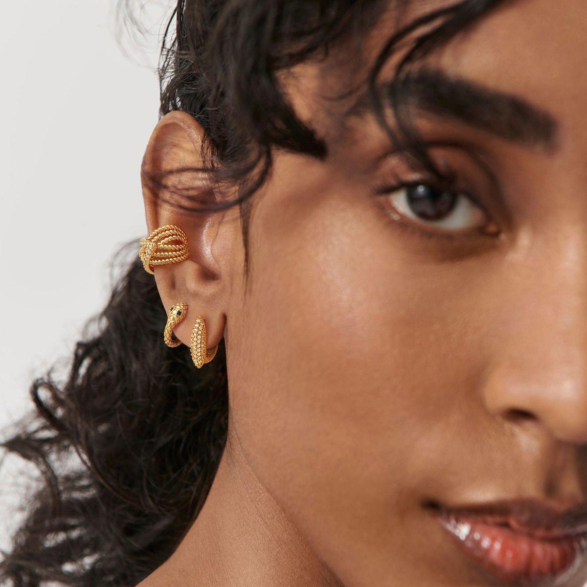 Close-up of model wearing MYEARS® leaf twisted ear cuff, showcasing elegant gold design for women