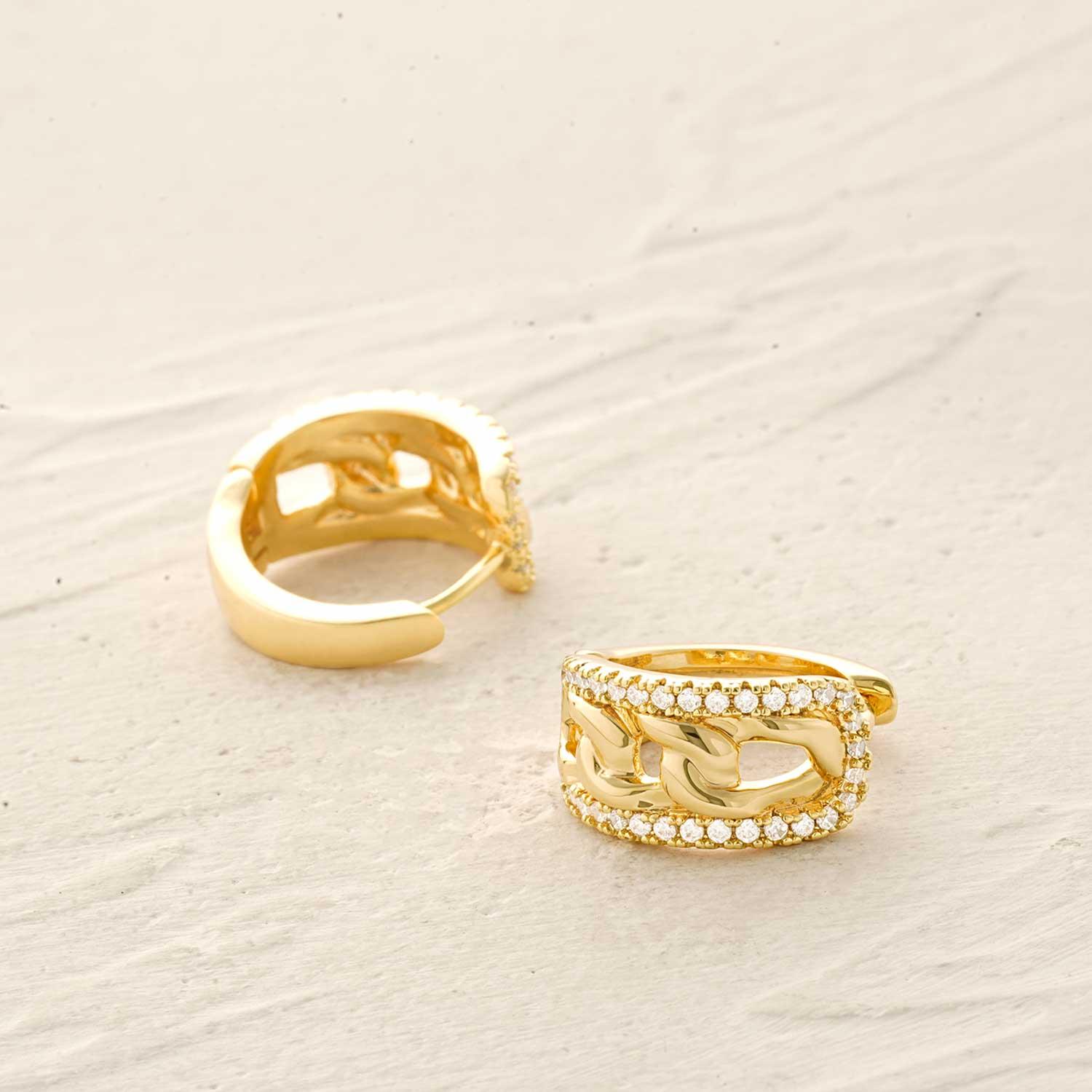 Lifestyle image of MYEARS® Link CZ Huggie Hoop Earrings, 14K gold plated, sparkling cubic zirconia huggie hoops for women, elegant and modern jewelry gift, perfect for everyday wear.