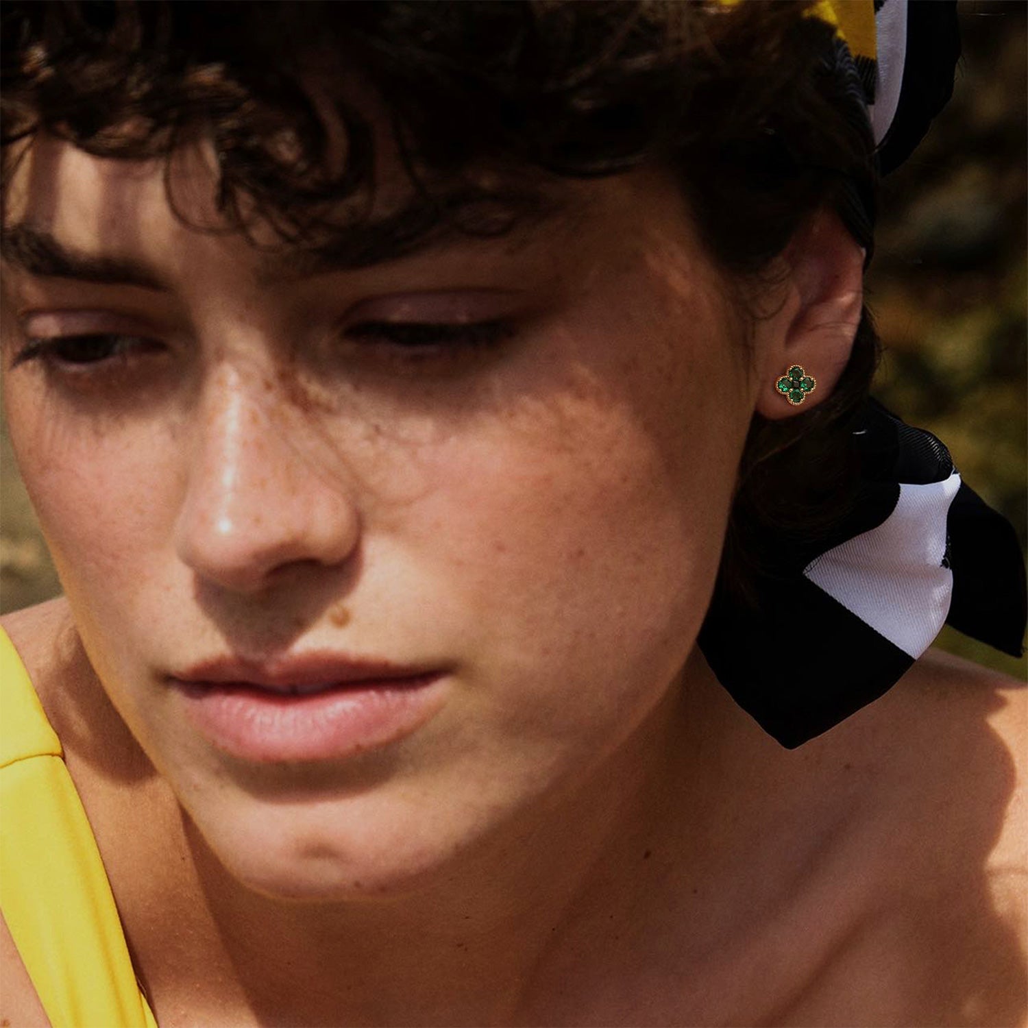 MYEARS May Flower Birthstone Stud Earrings in gold worn by woman, elegant and lucky earrings suitable for everyday wear