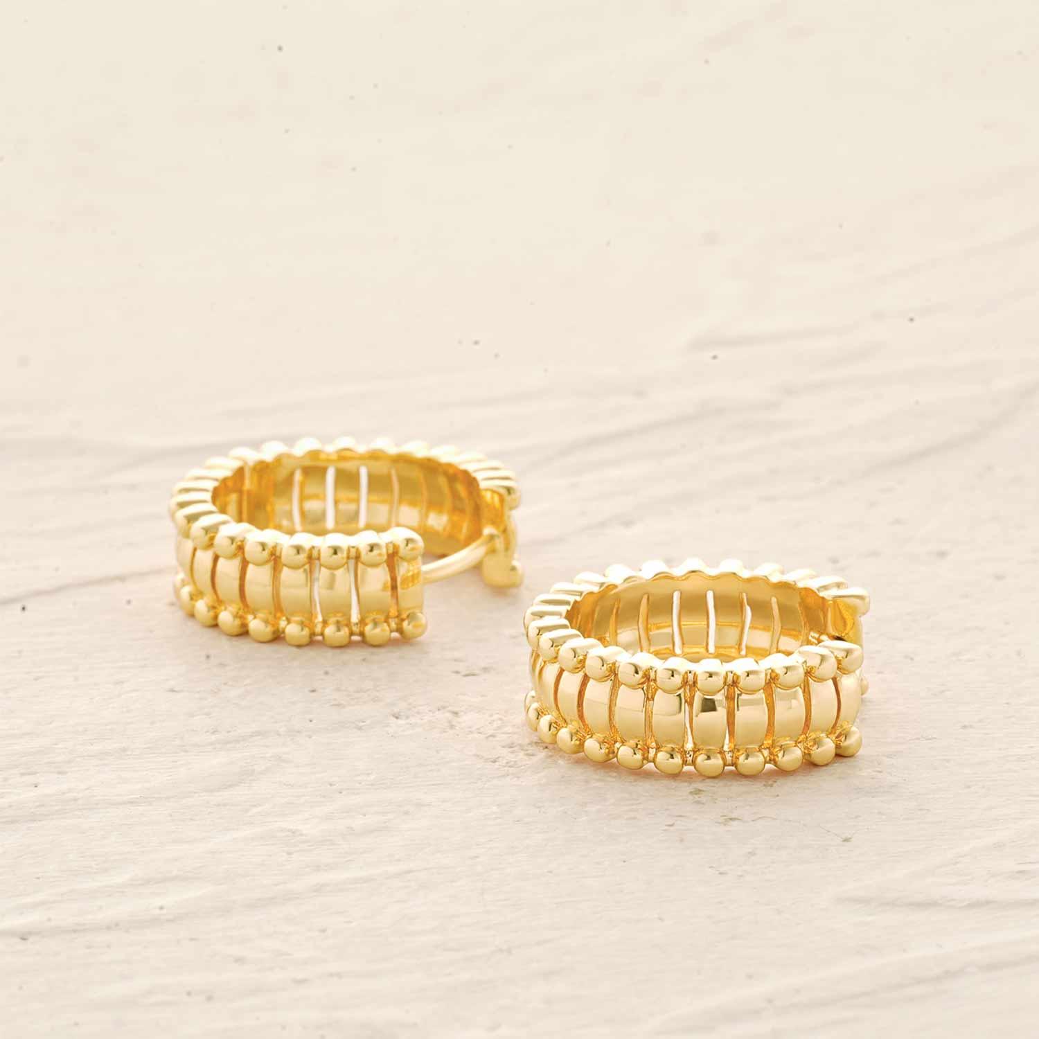 Close-up of MYEARS® pumpkin beaded ribbed hoop earrings showing textured gold bead design