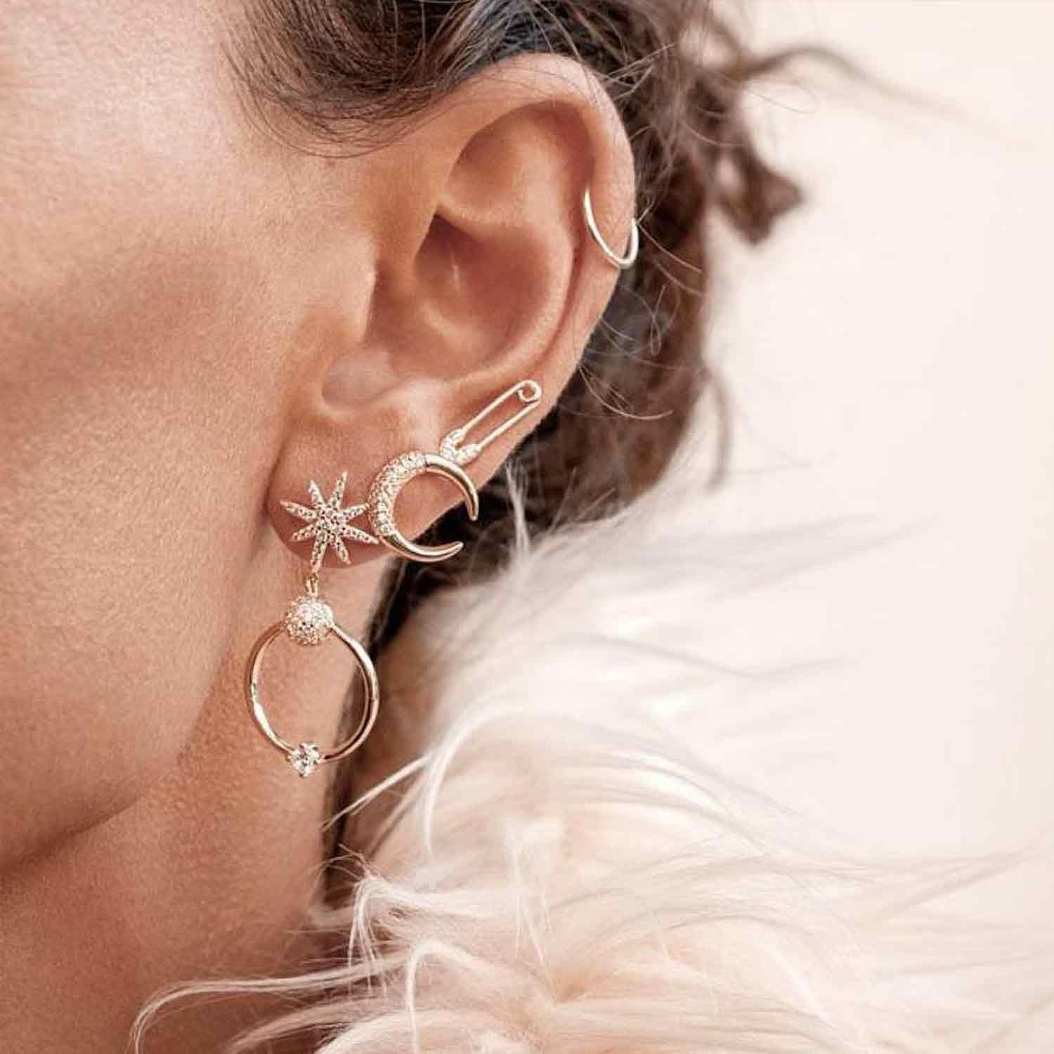 Close-up of model wearing MYEARS gold Safety Pin Stud Earrings, stylish earrings for women