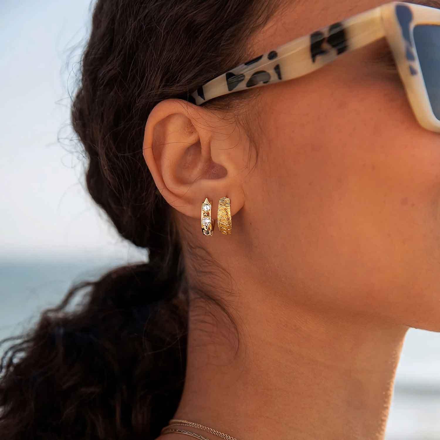 MYEARS® spike CZ huggie hoop earrings close-up in gold, stylish accessory for women