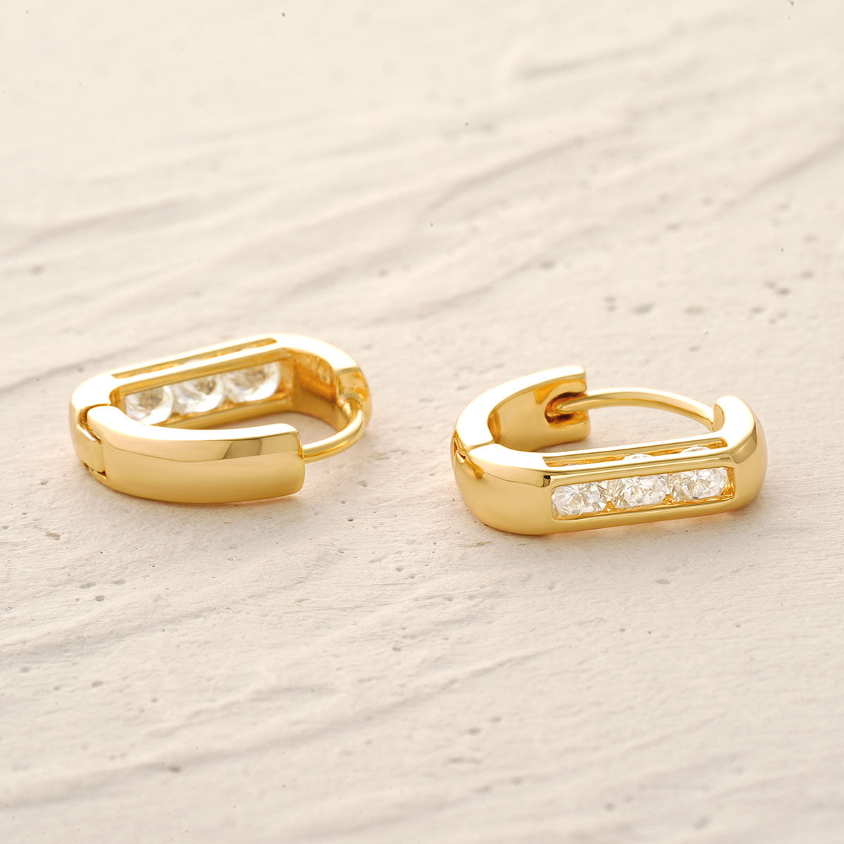 Detailed scene of MYEARS® Triple CZ Hoop Earrings in gold, showing the triple-row structure, cubic zirconia setting