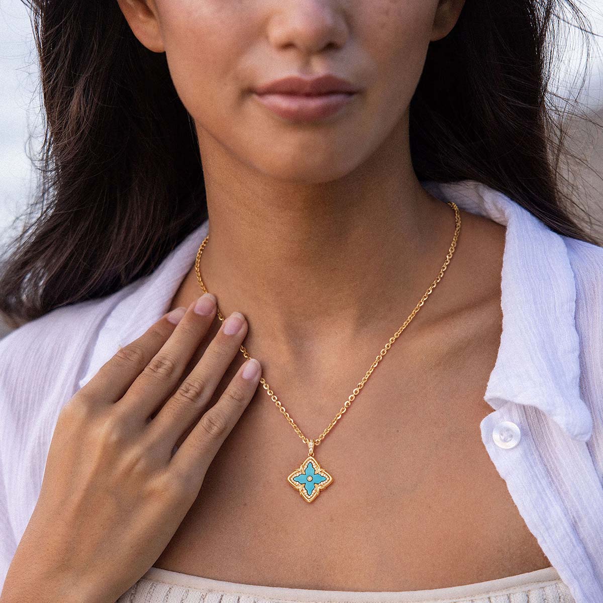 Model wearing MYEARS Turquoise Clover Medallion Necklace in gold, elegant and lucky design for women, perfect for everyday wear
