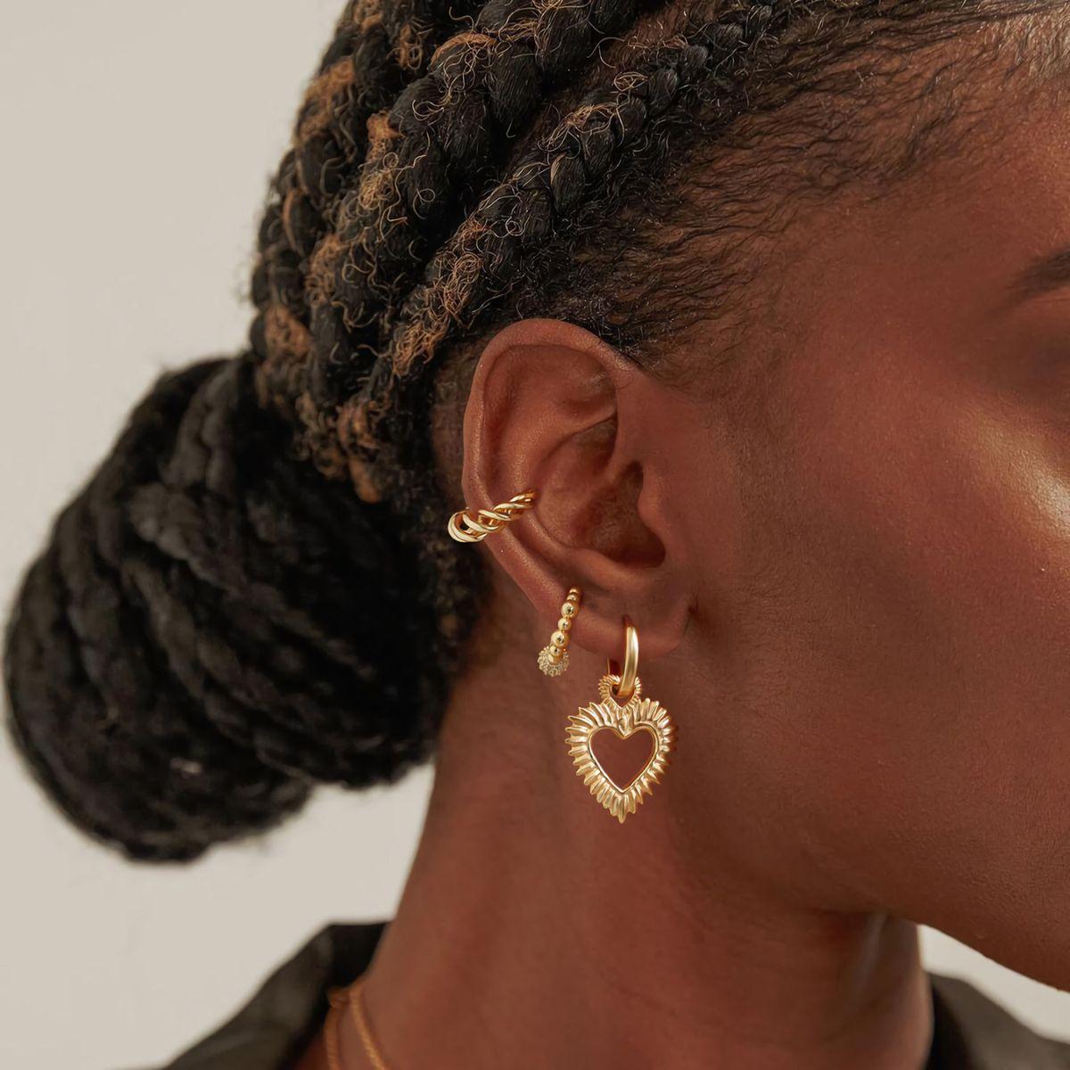 Lifestyle view of MYEARS® Twist Ear Cuffs No Piercing on a woman, gold fashion jewelry perfect for everyday wear and as a thoughtful gift