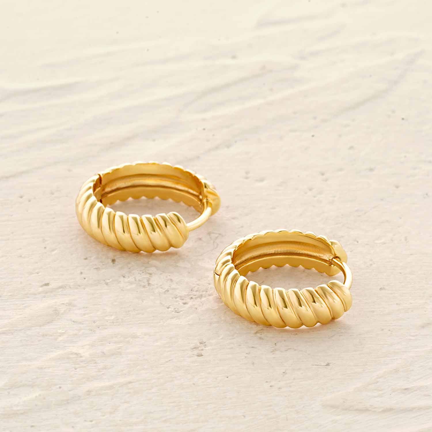 Detailed view of MYEARS® Twisted Hoop Earrings highlighting gold finish and unique twisted hoop craftsmanship