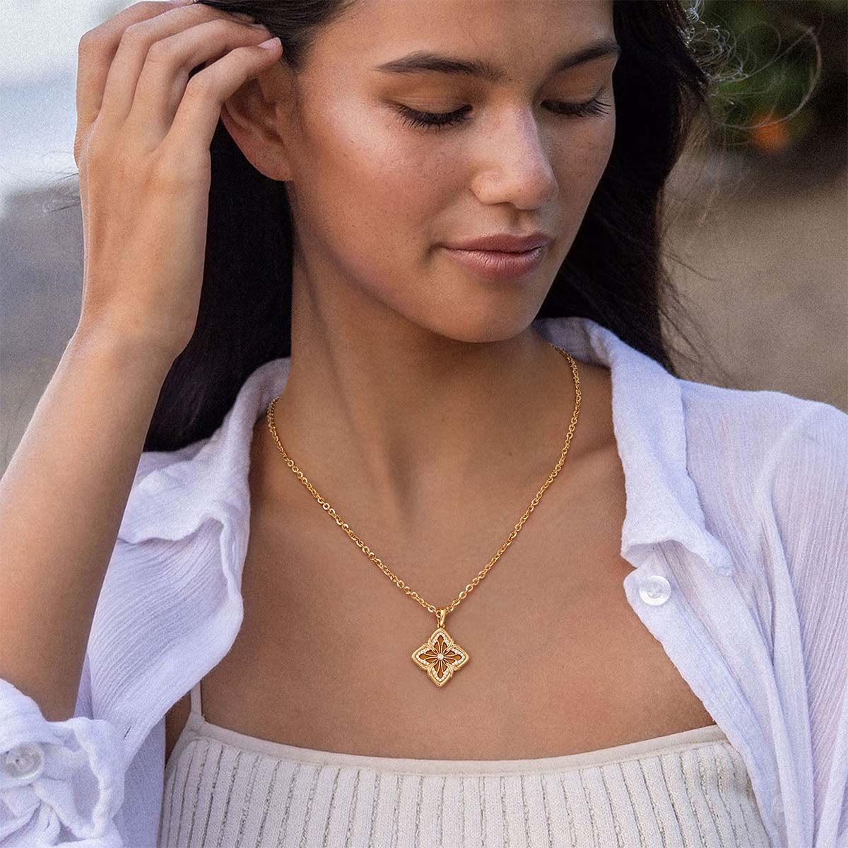 MYEARS Yellow Tiger’s Clover Medallion Necklace in gold worn by woman, elegant and lucky necklace suitable for everyday wear