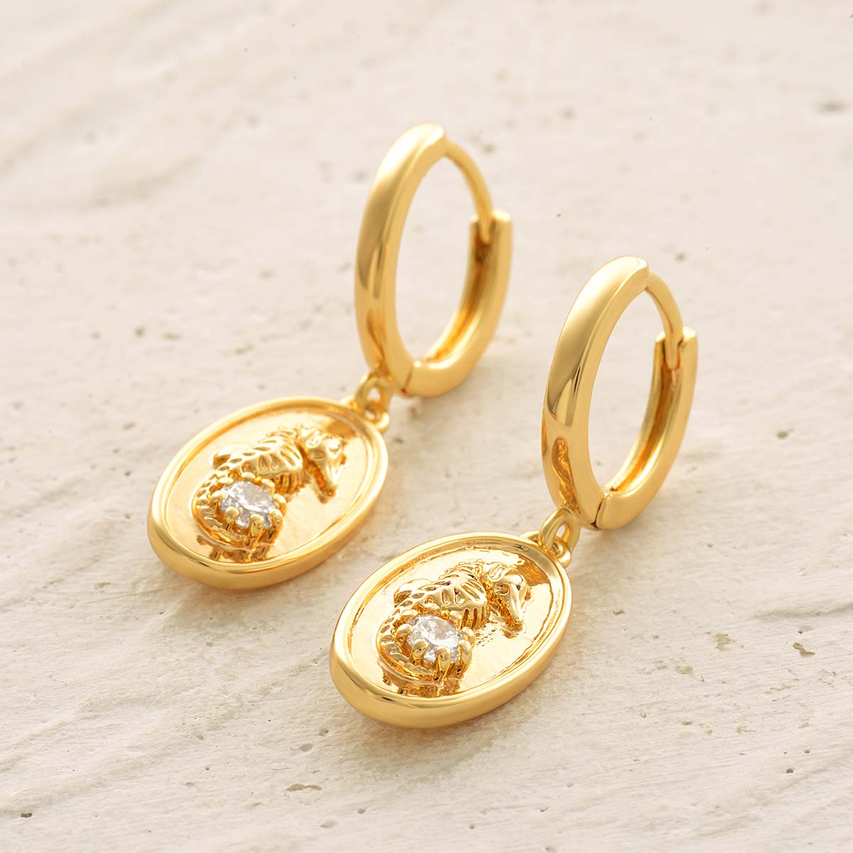 Detail scene of MYEARS® Seahorse Hoop Drop Earrings in gold, focusing on the seahorse motif, hanging movement