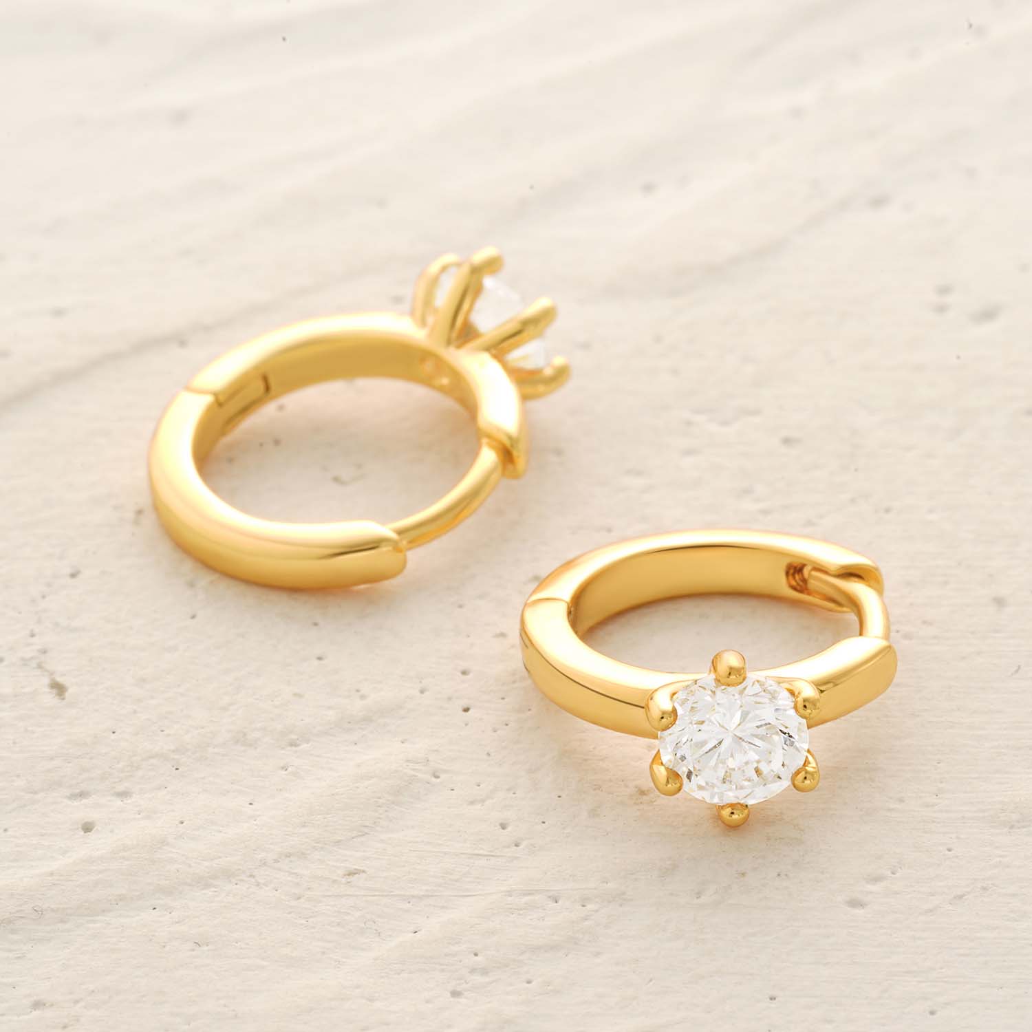 Detailed view of Single CZ Sleeper Hoop Earrings showing gold finish and cubic zirconia stones, ideal gift for women