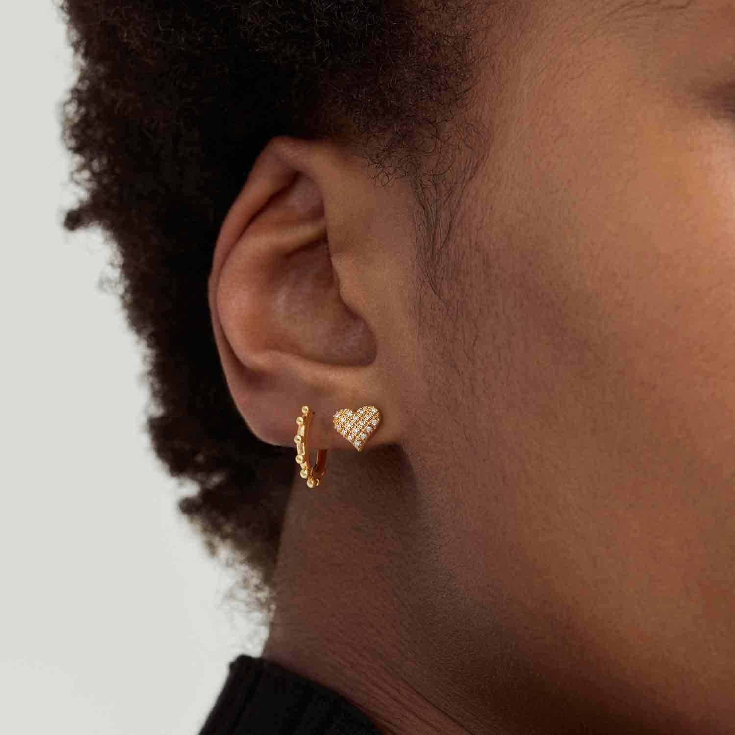 Close-up of MYEARS® Gold Sun Beaded Huggie Hoop Earrings, elegant earrings for women, detailed gold beaded sun design