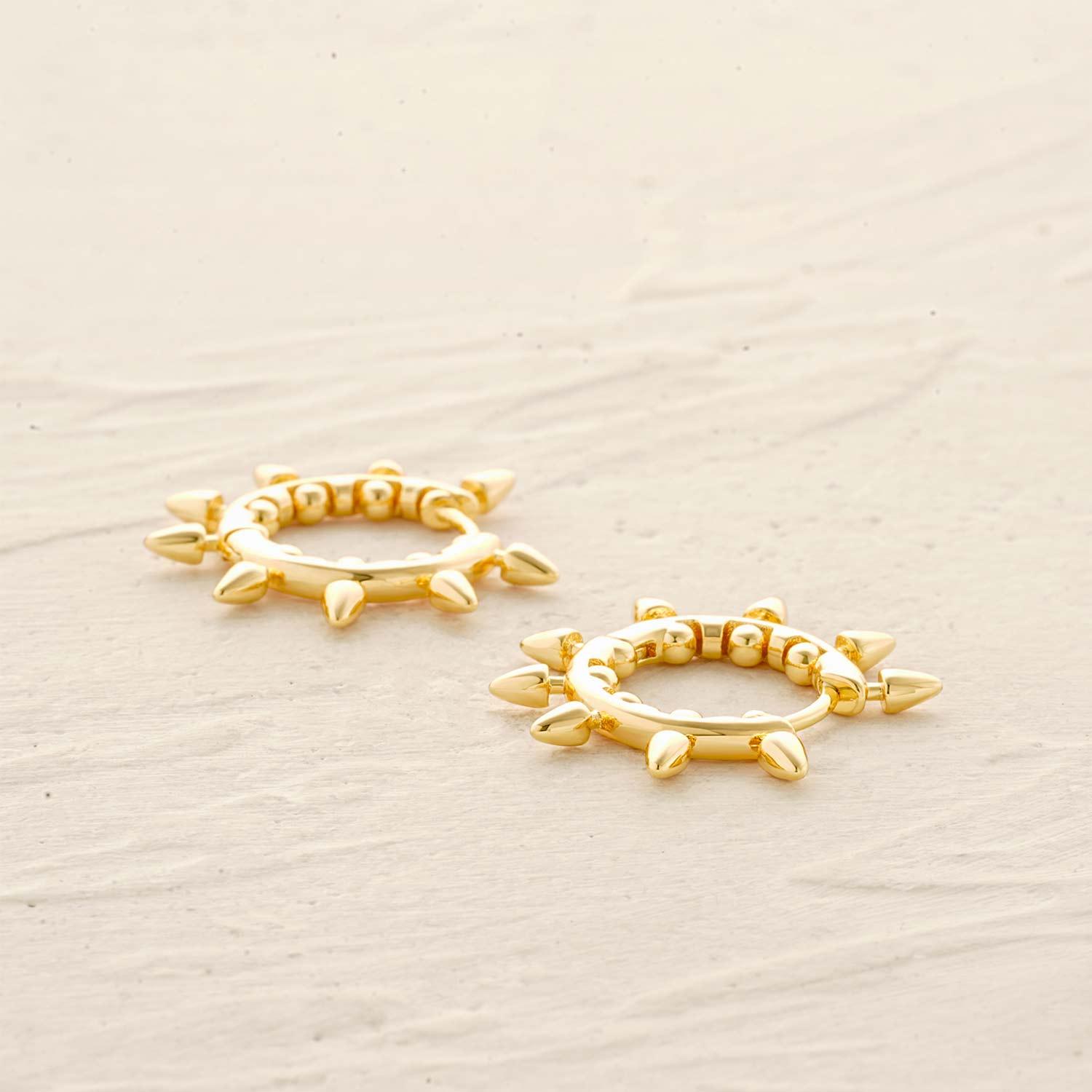 Close-up of Spike Arrow Bead Hoop Earrings showing gold finish and intricate bead design