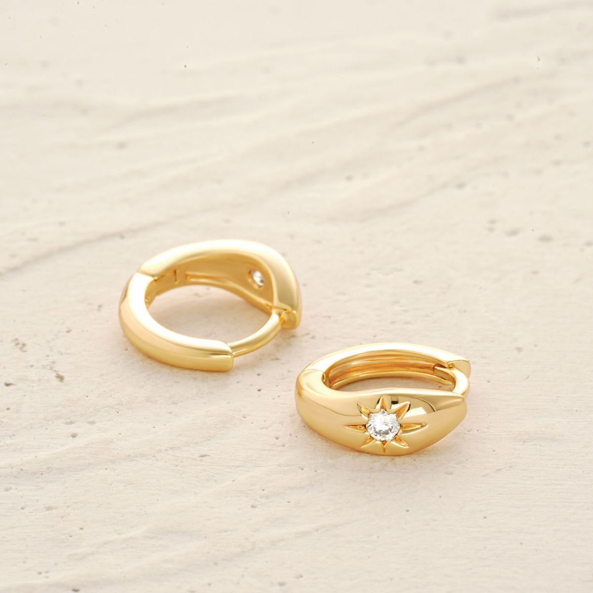 Close-up of Star Stone Huggie Hoop Earrings showing gold finish and star stone details