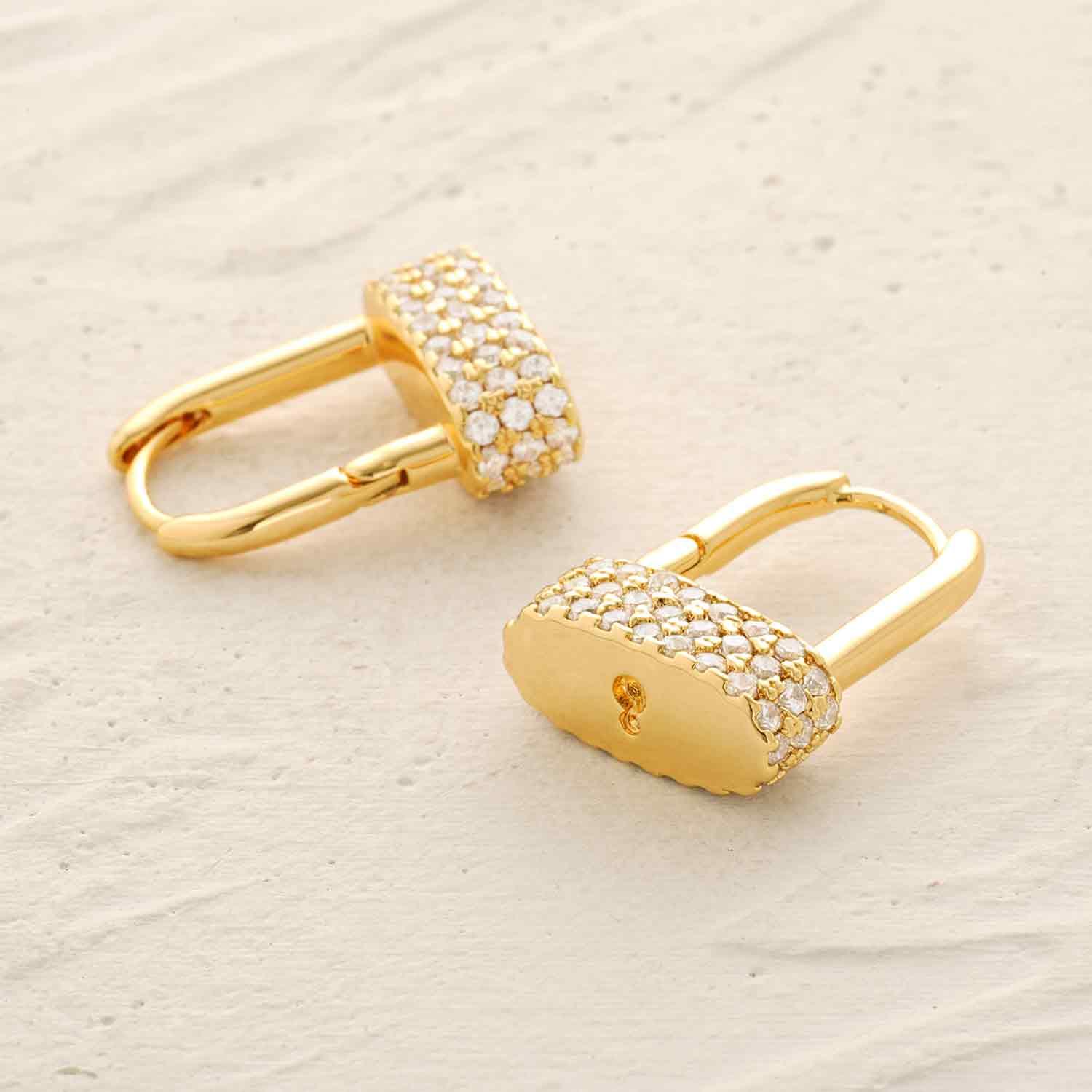 Lifestyle image of MYEARS® CZ Padlock Drop Hoop Earrings, 14K gold plated, sparkling cubic zirconia padlock hoop earrings for women, stylish gift and versatile jewelry, perfect for everyday wear and special occasions.