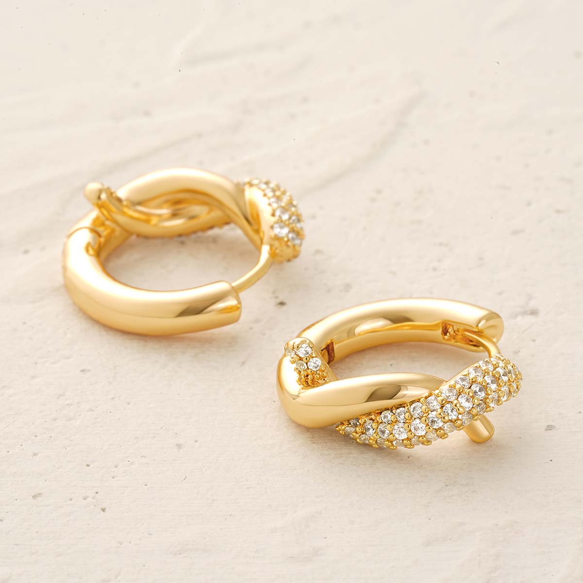 Detailed view of MYEARS® Gold Twisted Hoop Earrings, showcasing the twisted hoop style, zirconia setting, and refined craftsmanship